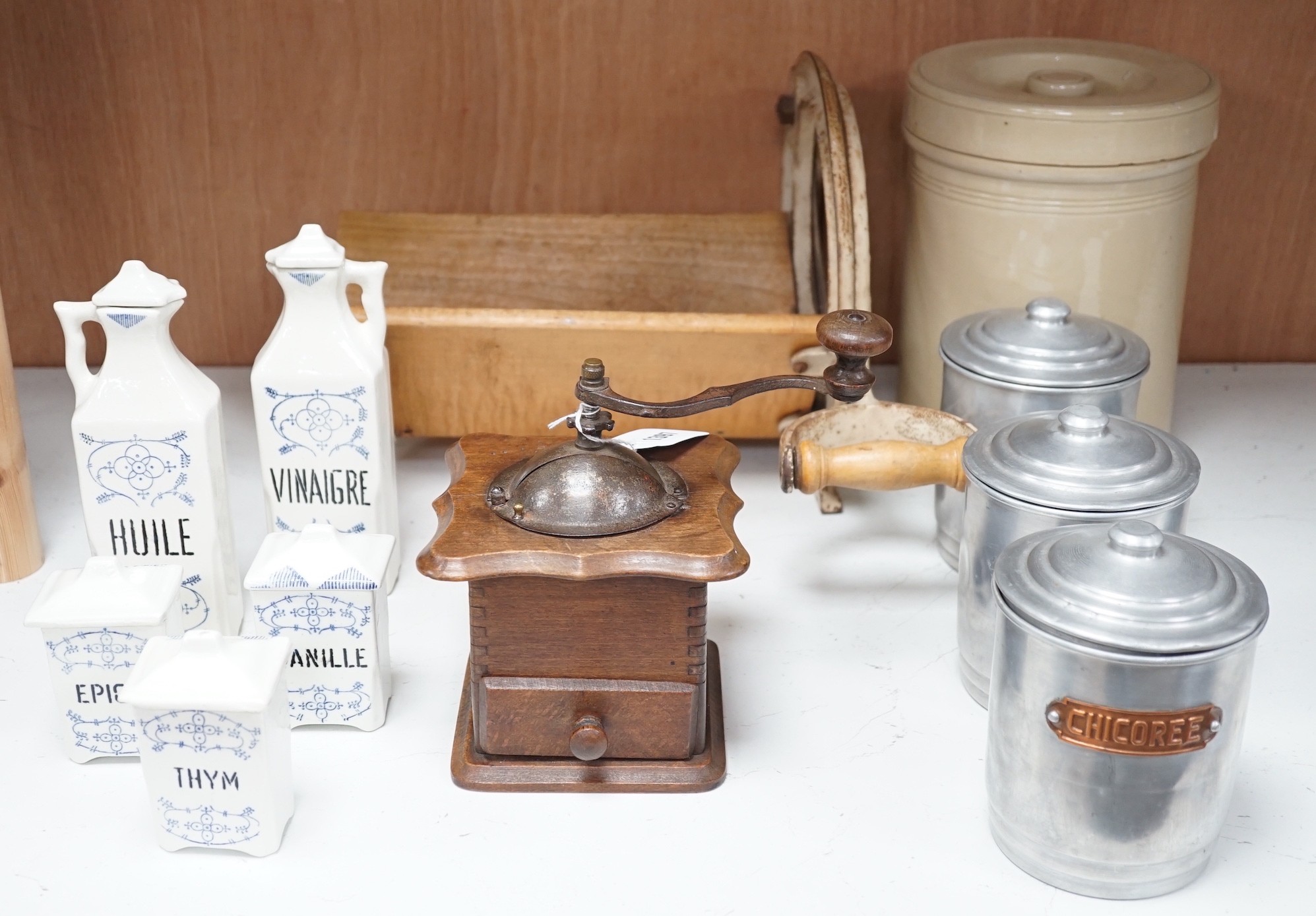 Kitchenalia: A group of French ceramic storage jars and metal canisters, a Danish bread slicer, a French coffee grinder and a croc and cover, bread slicer 31cms wide